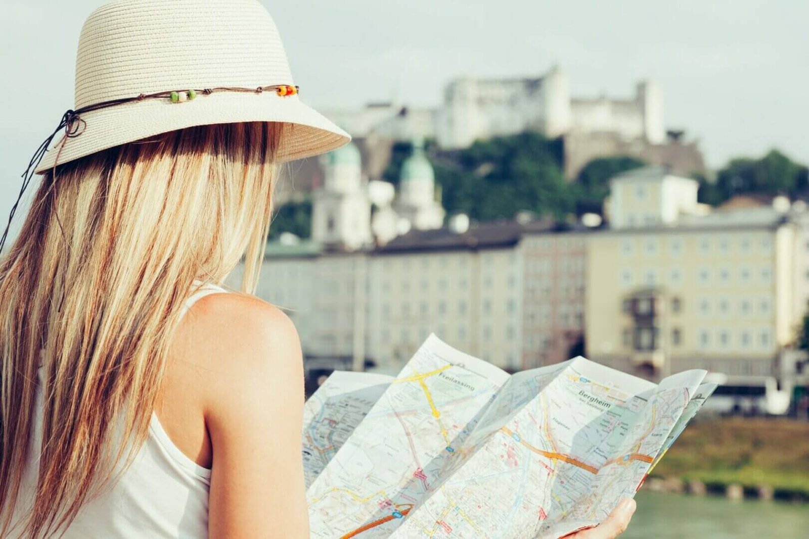 Female tourist on vacation in Salzburg Austria holding a local map
