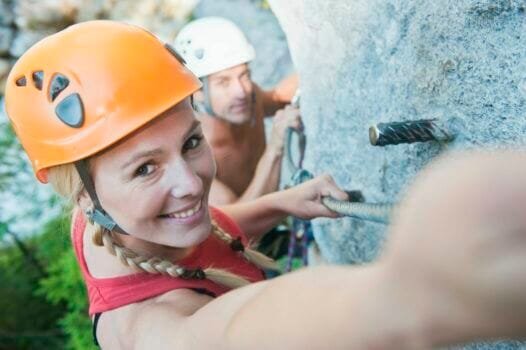 Austria, Steiermark, Ramsau, Silberkarklamm, Young couple rock climbing