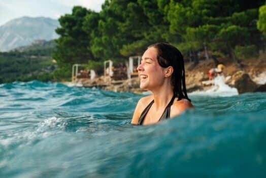 girl is bathing in sea