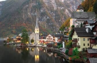 view of famous Hallstatt lakeside town reflecting in Hallstattersee lake in the Austrian Alps