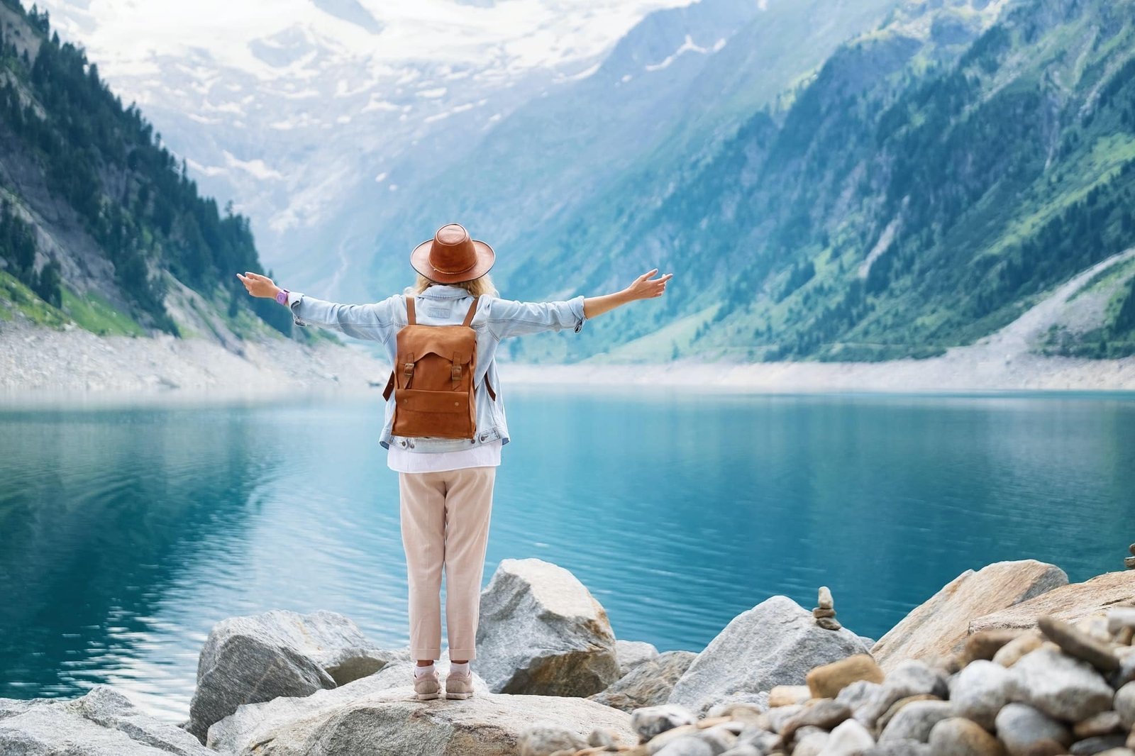 Traveler looks at the lake in Austria. Travel and tourism