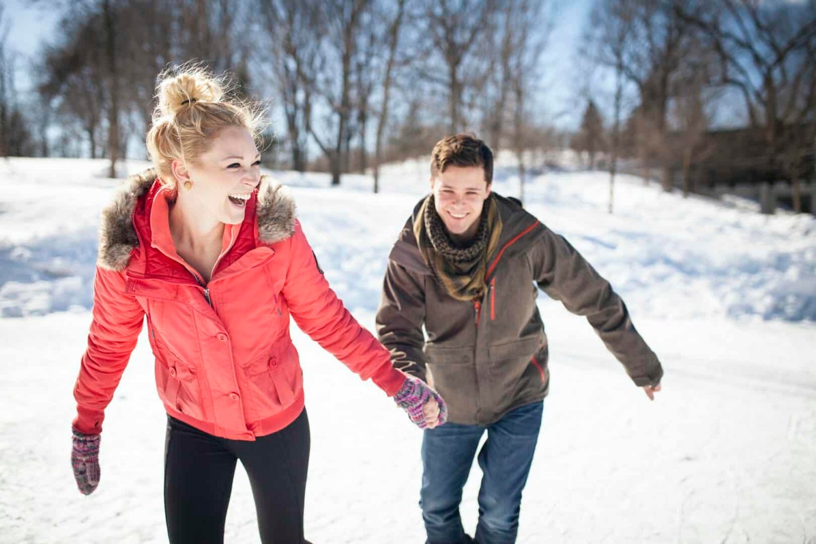 55326,Caucasian couple ice skating on frozen lake