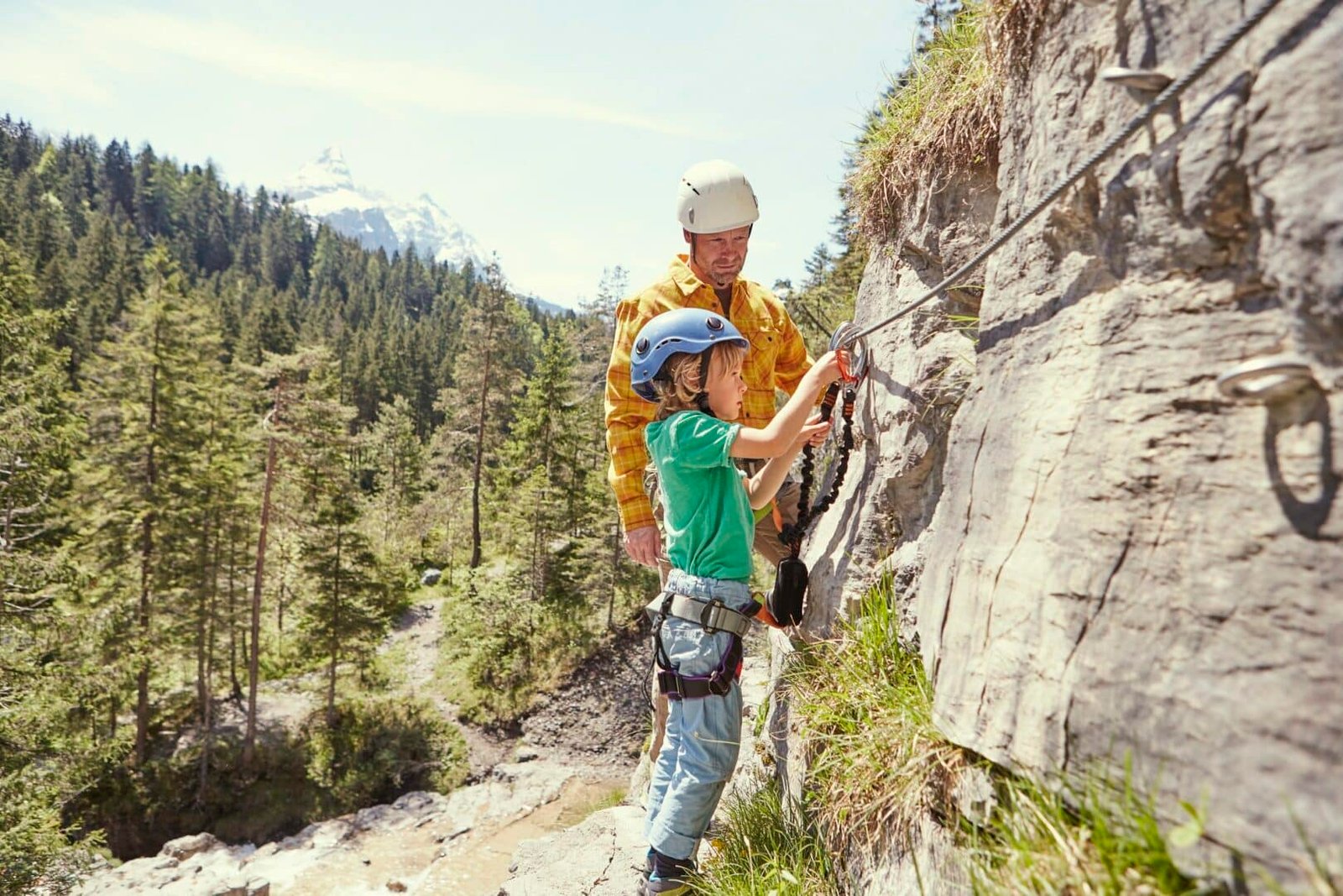 Father and child rock climbing, Ehrwald, Tyrol, Austria