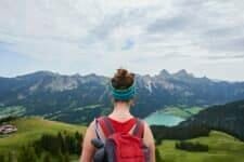 Rear view of female hiker looking out over valley in Tannheim mountains, Tyrol, Austria