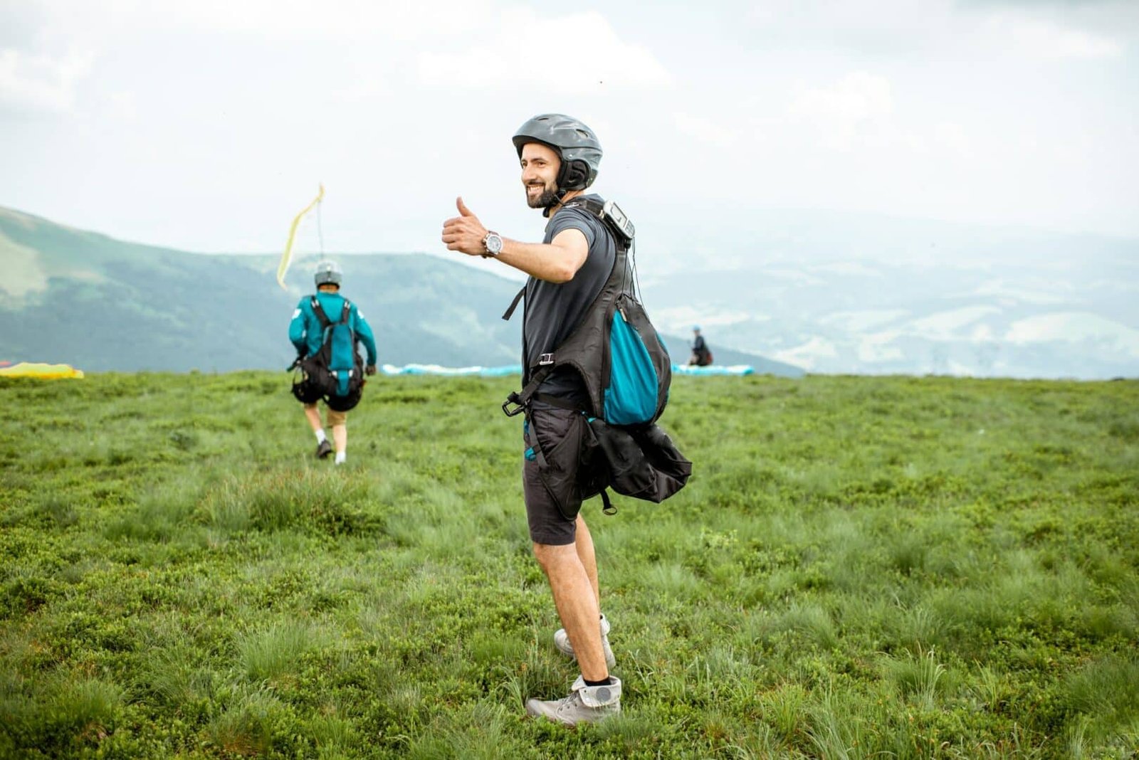 Man preparing for the paraglider flight