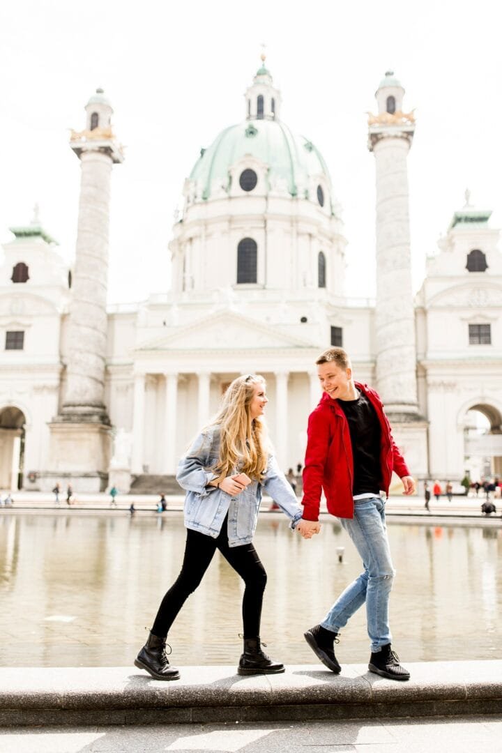 Couple walking holding hands around Vienna, Austria