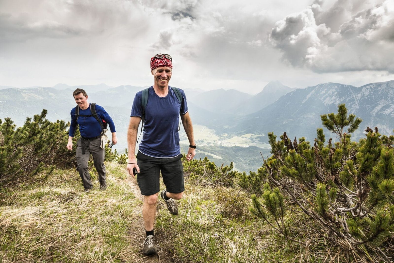 Two mature male hikers hiking in mountains, Achenkirch, Austria