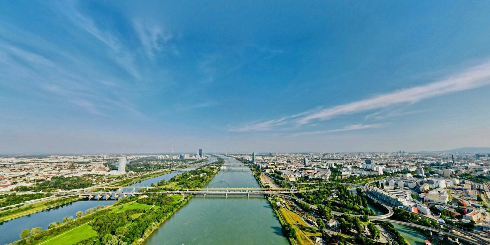 Ultra Wide angle aerial view of Vienna Austria at Danube river and city skyline